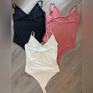 Bundle of 3 bodysuits tops, fits size XS-M,- Black, Pink, and White
